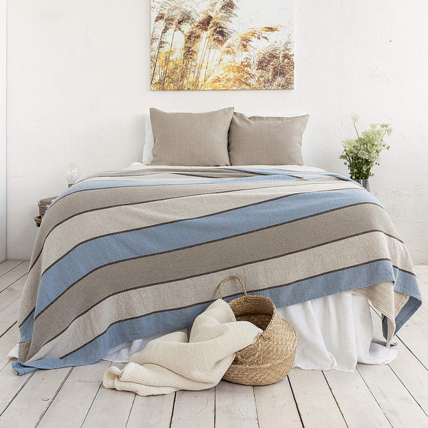 Multicoloured Striped pattern linen throw crafted from a softened natural linen, adds a warmth and style to any bedroom decor.Whether you choose to drape it as a bed throw or wrap yourself in its soft embrace on chilly evenings, this versatile blanket offers both functionality and elegance.