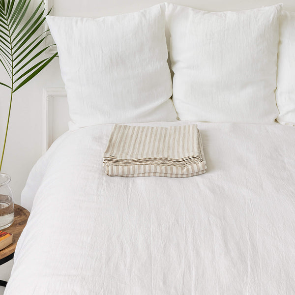 Linen flat sheet, elegantly striped in white and natural tones.Crafted for the modern bedroom, these sheets offer unparalleled softness and breathability, ensuring a comfortable night's sleep year-round.