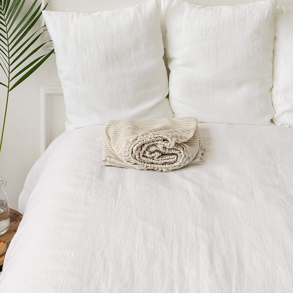 Delicately striped in a harmonious blend of white and natural hues.Crafted with care, these sheets offer a gentle touch and unparalleled breathability, ensuring a restful night's sleep in every modern bedroom.