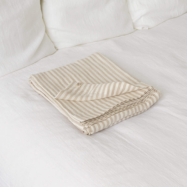 Linen flat sheet, elegantly striped in white and natural tones.Crafted for the modern bedroom, these sheets offer unparalleled softness and breathability, ensuring a comfortable night's sleep year-round.