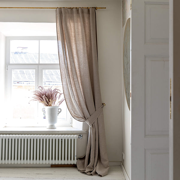 Our natural unbleached linen curtain tie-back is the perfect solution for keeping your curtains looking neat and stylish. Made from the highest-quality European linen, they offer durability and a luxurious feel.