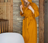 Immerse yourself in our amber yellow natural linen bathrobe and enjoy the exceptional comfort and elegance and breathability of natural linen.
