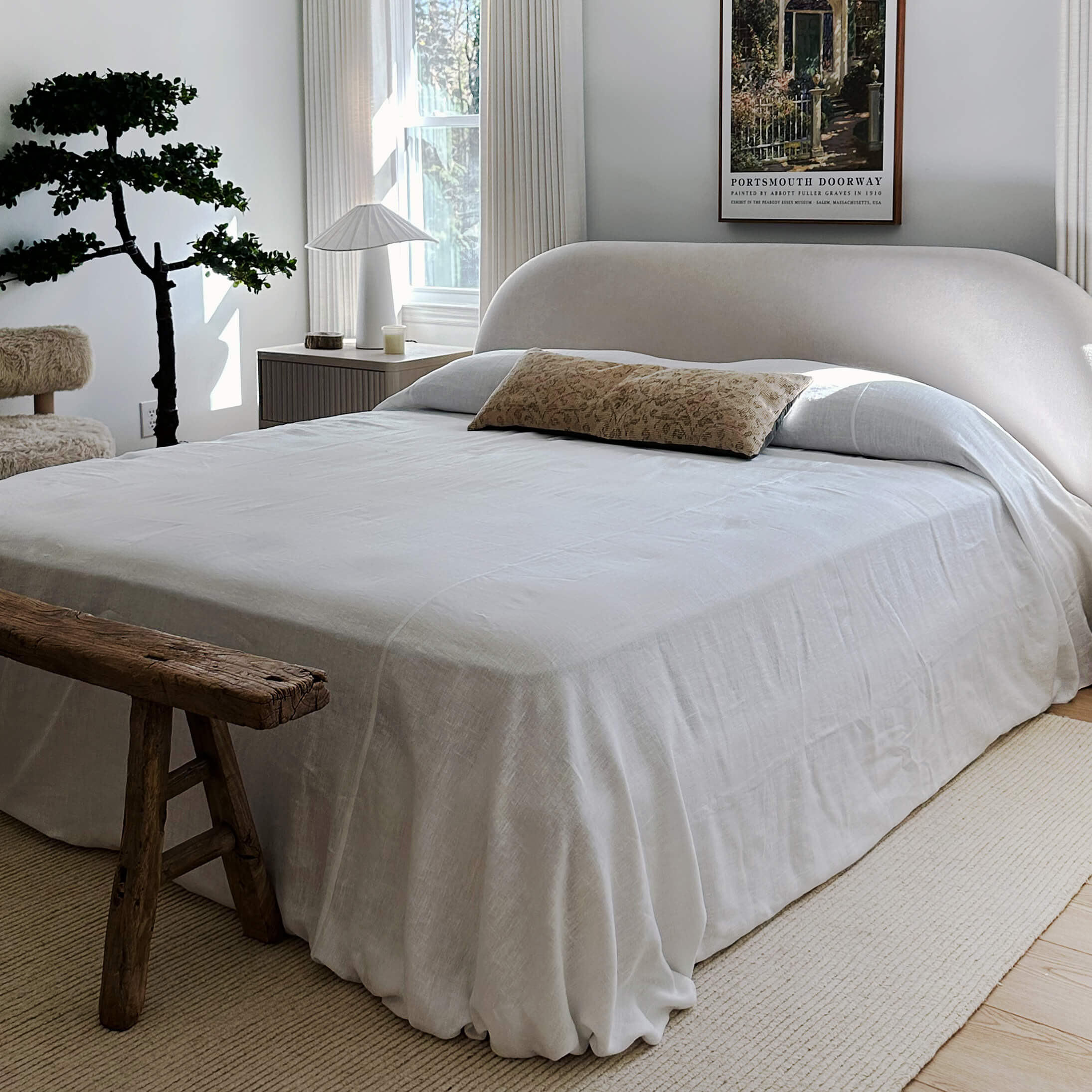 Bright white linen bedspread designed to infuse your bed with an extra touch of uniqueness, coziness and charm. Draped elegantly over your bed as a bedspread or wrapped snugly around you on chilly nights, it's versatile enough to suit your needs.
