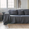 Renew your living space effortlessly with our charcoal grey linen couch cover. Its thoughtful design ensures complete coverage, extending gracefully over the arms. Discover the perfect balance of functionality and elegance with our collection today.