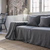 Renew your living space effortlessly with our charcoal grey linen couch cover. Its thoughtful design ensures complete coverage, extending gracefully over the arms. Discover the perfect balance of functionality and elegance with our collection today.