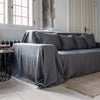 Renew your living space effortlessly with our charcoal grey linen couch cover. Its thoughtful design ensures complete coverage, extending gracefully over the arms. Discover the perfect balance of functionality and elegance with our collection today.