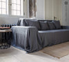 Renew your living space effortlessly with our charcoal grey linen couch cover. Its thoughtful design ensures complete coverage, extending gracefully over the arms. Discover the perfect balance of functionality and elegance with our collection today.
