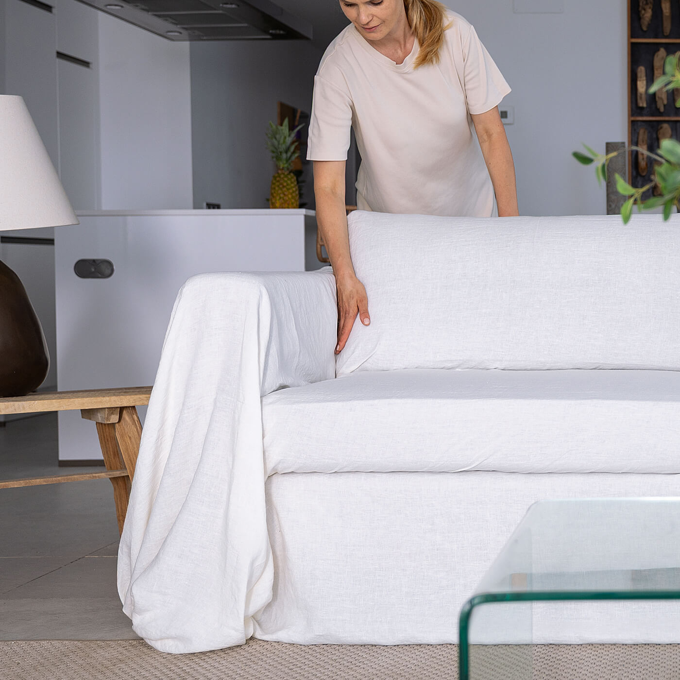 Tucking the second arm and the sides of the back cushions