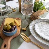 Give your table a touch of distinction and decoration with our moss green linen table runner. Use the table runner on its own or combine it with a linen tablecloth, placemats or napkins.