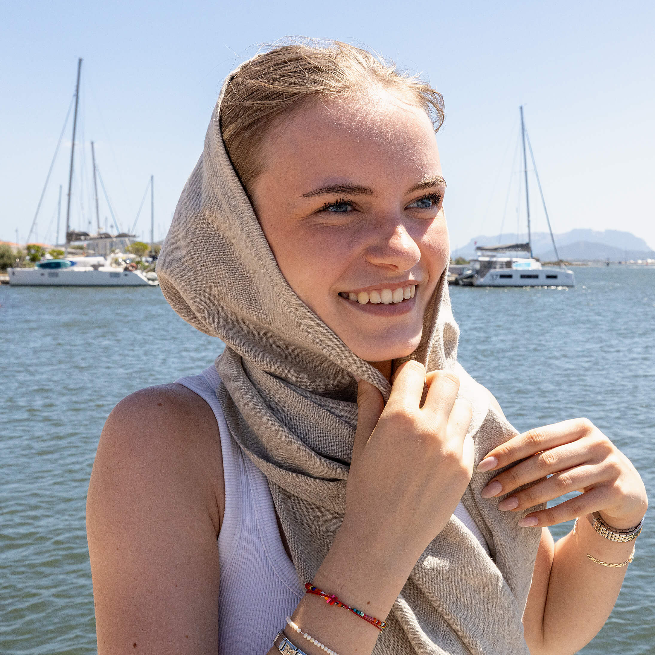 Natural linen scarf offers natural sun protection, breathability and a relaxed elegance that pairs effortlessly with any outfit.
