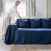 Navy blue linen couch cover designed and crafted to elevate your interior with a fresh look and great energy. It offers a practical solution for safeguarding your furniture against the playful antics of your beloved pets.