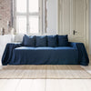Navy blue linen couch cover designed and crafted to elevate your interior with a fresh look and great energy. It offers a practical solution for safeguarding your furniture against the playful antics of your beloved pets.