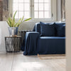 Navy blue linen couch cover designed and crafted to elevate your interior with a fresh look and great energy. It offers a practical solution for safeguarding your furniture against the playful antics of your beloved pets.