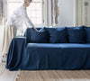 Navy blue linen couch cover designed and crafted to elevate your interior with a fresh look and great energy. It offers a practical solution for safeguarding your furniture against the playful antics of your beloved pets.