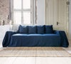 Navy blue linen couch cover designed and crafted to elevate your interior with a fresh look and great energy. It offers a practical solution for safeguarding your furniture against the playful antics of your beloved pets.