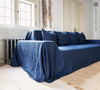 Navy blue linen couch cover designed and crafted to elevate your interior with a fresh look and great energy. It offers a practical solution for safeguarding your furniture against the playful antics of your beloved pets.