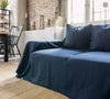 Navy blue linen couch cover designed and crafted to elevate your interior with a fresh look and great energy. It offers a practical solution for safeguarding your furniture against the playful antics of your beloved pets.