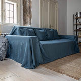 Ocean blue linen couch cover designed and crafted to elevate your interior with a fresh look and great energy. It offers a practical solution for safeguarding your furniture against the playful antics of your beloved pets. 