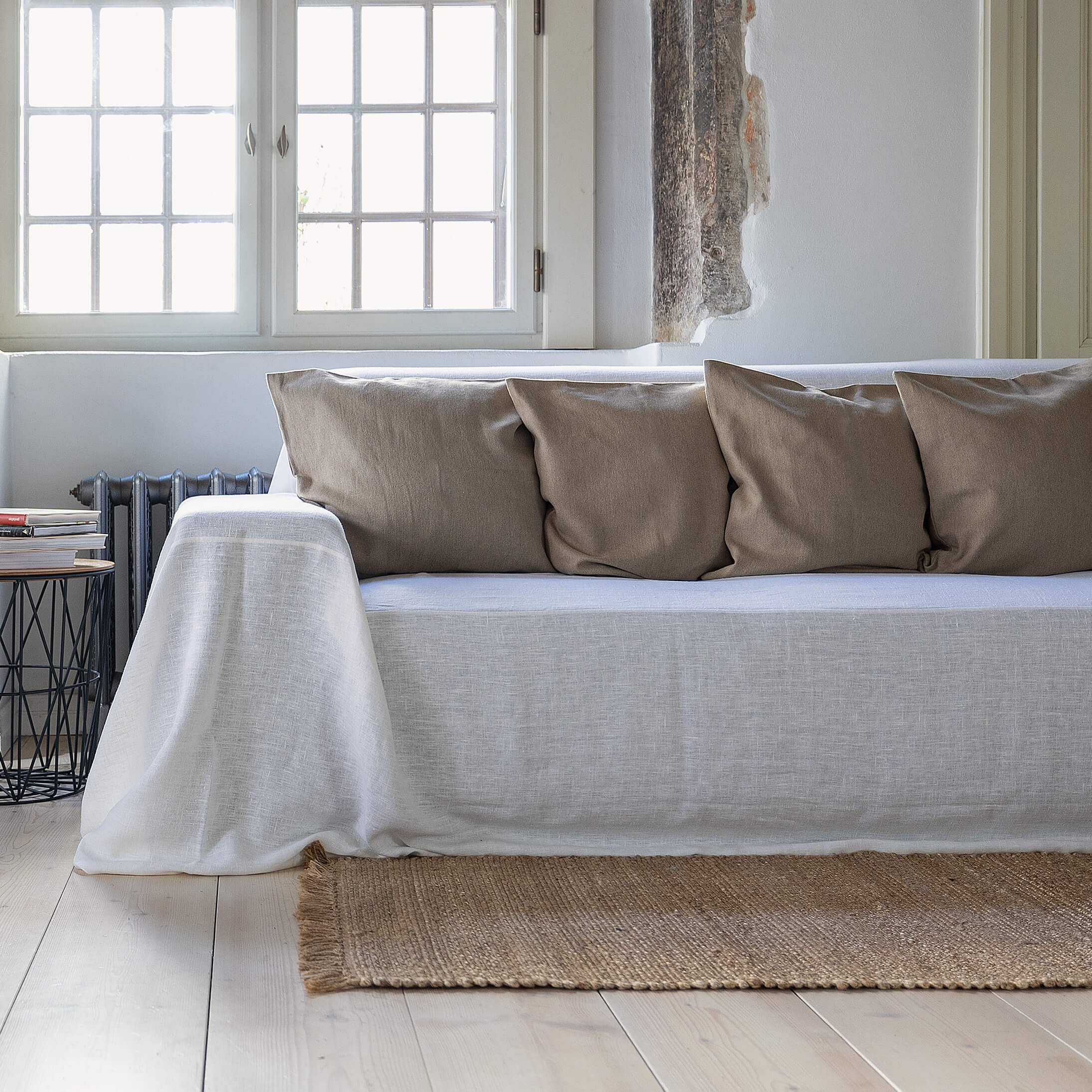 Choosing optical white colour for your couch cover not only offers protection but also brings a timeless elegance to your home interior.