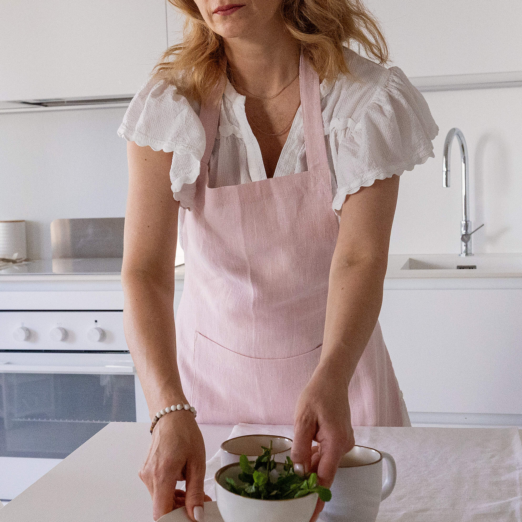 Explore our diverse range of styles, from classic neutrals to vibrant hues, and discover the apron that complements your personal taste and kitchen decor.