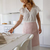 Explore our diverse range of styles, from classic neutrals to vibrant hues, and discover the apron that complements your personal taste and kitchen decor.