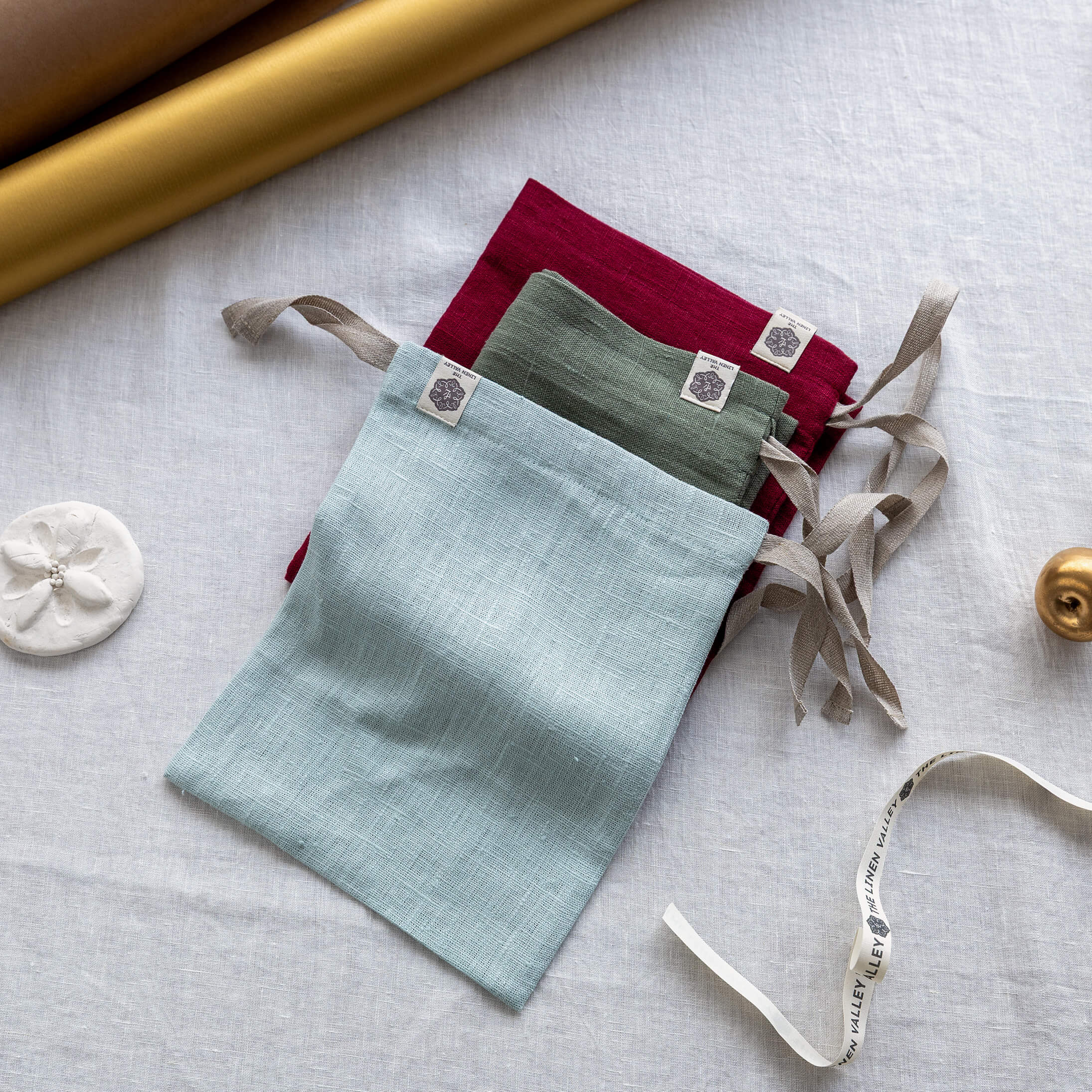 Set of three dyed linen bread bags in duck egg blue, moss green and burgundy red European linen