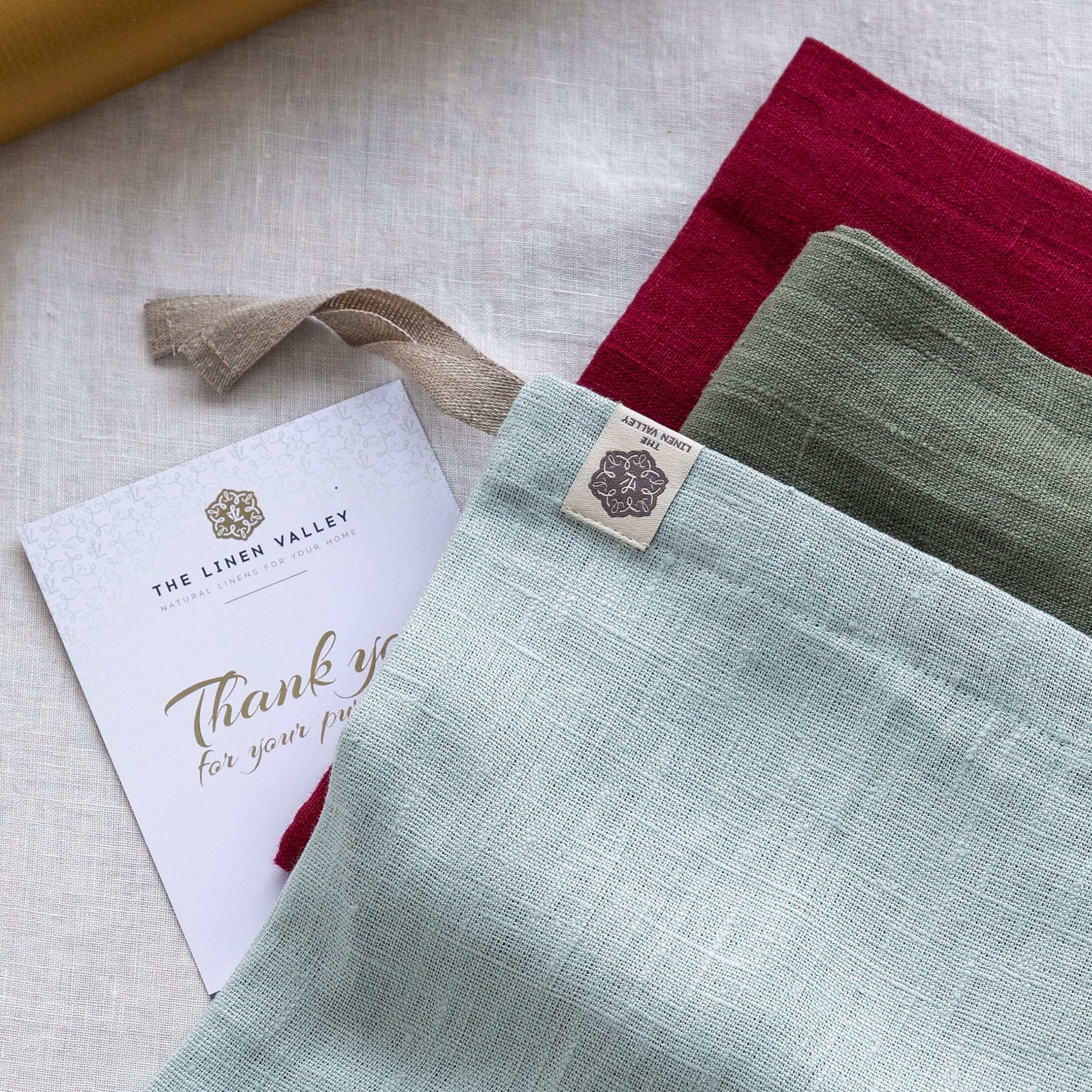 Set of three dyed linen bread bags in duck egg blue, moss green and burgundy red European linen