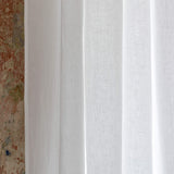 Our optical white linen curtains with ruffles are designed and made to give your home unique and timeless charm. Linen curtains would complement interiors from minimalistic, Scandinavian or modern to Mediterranean or classical style.