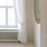 Our optical white linen curtain tie-back the perfect solution to keeping your curtains looking neat and stylish.