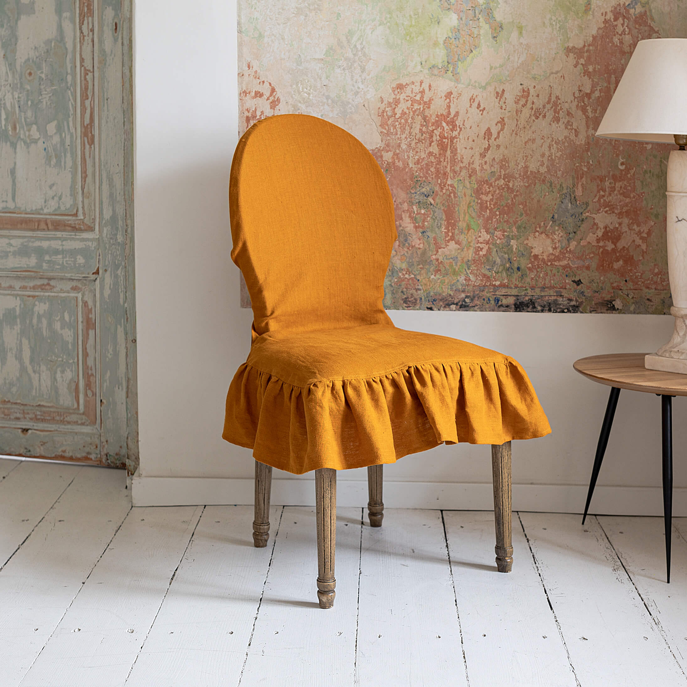 Our amber yellow linen slipcovers offer both practicality and aesthetic appeal. The covers will protect dining chairs from spills and stains, also enhance the visual appeal of your space with their timeless natural style.