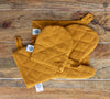 Crafted with care, these amber yellow linen oven mitten sets are the perfect companions for your culinary adventures.