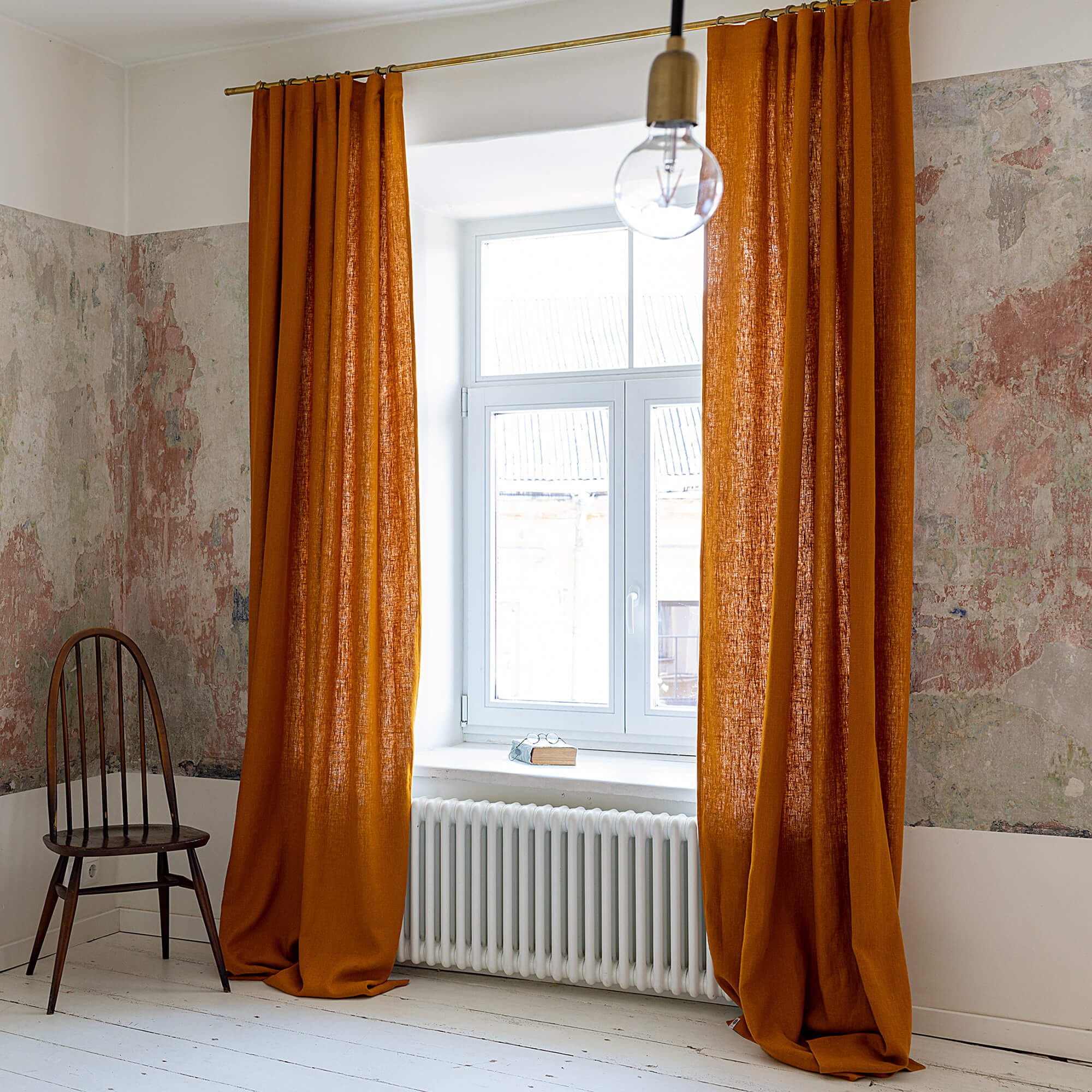 Lined amber yellow linen curtains with lining, designed to provide maximum protection from the sun and heat coming through the window. Natural thermoregulatory properties of linen will help you to create the most comfortable atmosphere at home.