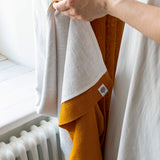 Lined amber yellow linen curtains with lining, designed to provide maximum protection from the sun and heat coming through the window. Natural thermoregulatory properties of linen will help you to create the most comfortable atmosphere at home.