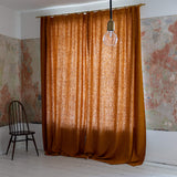 Lined amber yellow linen curtains with lining, designed to provide maximum protection from the sun and heat coming through the window. Natural thermoregulatory properties of linen will help you to create the most comfortable atmosphere at home.