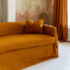 Introducing our Amber Yellow linen couch cover, crafted to enhance the beauty and functionality of your sofa. Designed to shield your couch from daily spills and stains, this cover offers both practicality and elegance.
