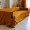 Introducing our Amber Yellow linen couch cover, crafted to enhance the beauty and functionality of your sofa. Designed to shield your couch from daily spills and stains, this cover offers both practicality and elegance.
