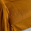 Introducing our Amber Yellow linen couch cover, crafted to enhance the beauty and functionality of your sofa. Designed to shield your couch from daily spills and stains, this cover offers both practicality and elegance.