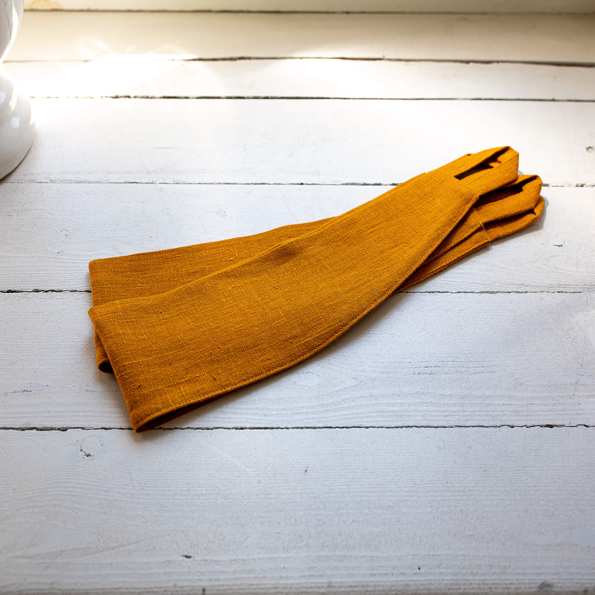 Our amber yellow linen curtain tie-back is the perfect solution for keeping your curtains looking neat and stylish. Made from the highest-quality European linen, they offer durability and a luxurious feel.