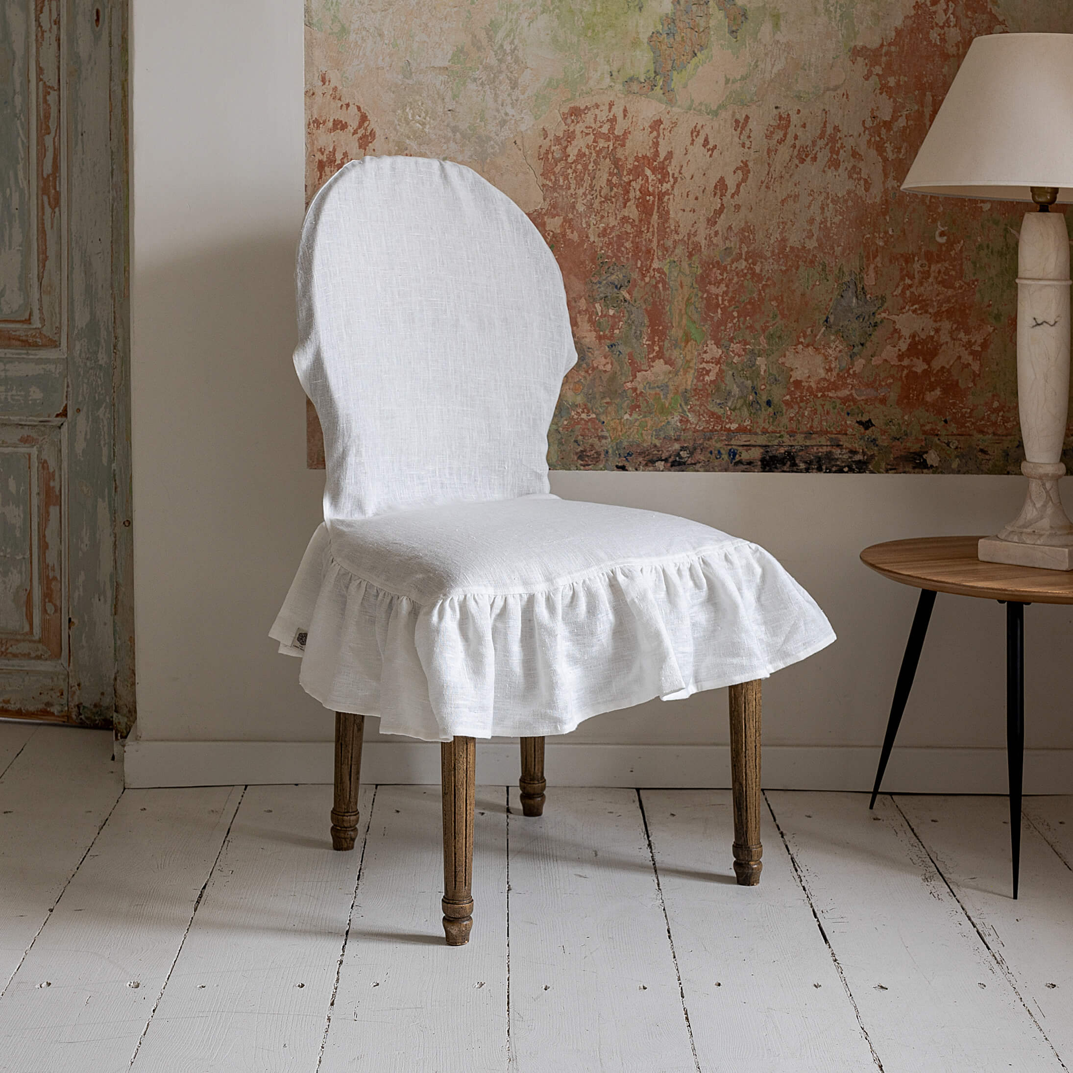 Our Antique white linen slipcovers offer both practicality and aesthetic appeal. The covers will protect dining chairs from spills and stains, also enhance the visual appeal of your space with their timeless natural style.