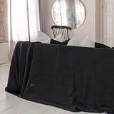 Choosing black colour for your sofa not only offers protection but also brings a timeless elegance, natural linen covers can enhance the aesthetic of your living space while ensuring long-lasting protection for your furniture.
