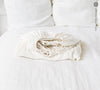 Our optical white linen fitted sheet, designed to elevate the comfort and style of your classical bedroom.