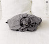 Our charcoal gray linen fitted sheet, the epitome of modern bedroom luxury.