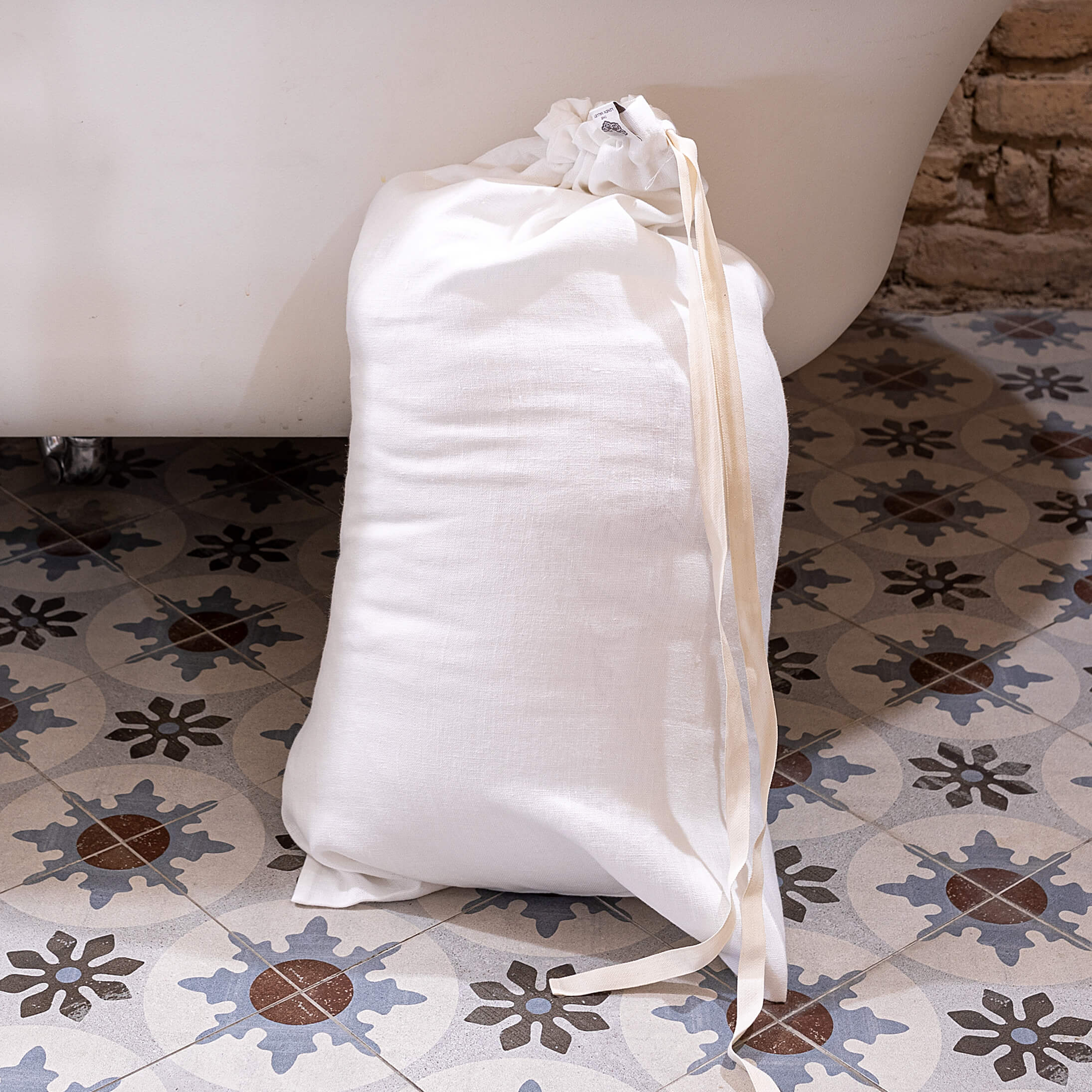 Introducing our optical white linen laundry bag, the ultimate solution for keeping your laundry organised in style.