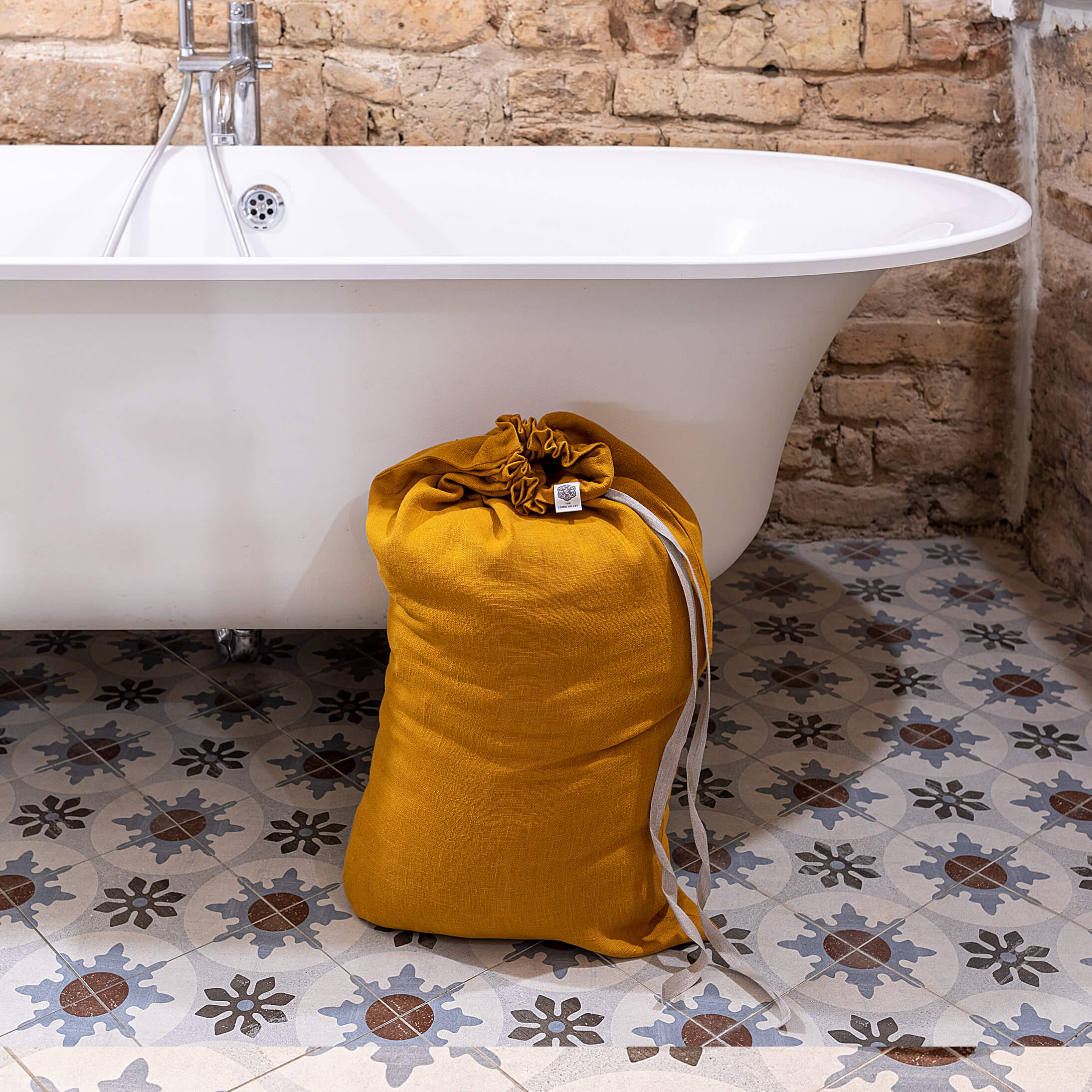 Introducing our amber yellow linen laundry bag, the ultimate solution for keeping your laundry organised in style.