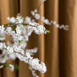 Dusty Mustard curtains with a decorative white floral wreath in front