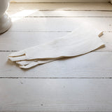 Our off white linen curtain tie-back is the perfect solution for keeping your curtains looking neat and stylish. Made from the highest-quality European linen, they offer durability and a luxurious feel.