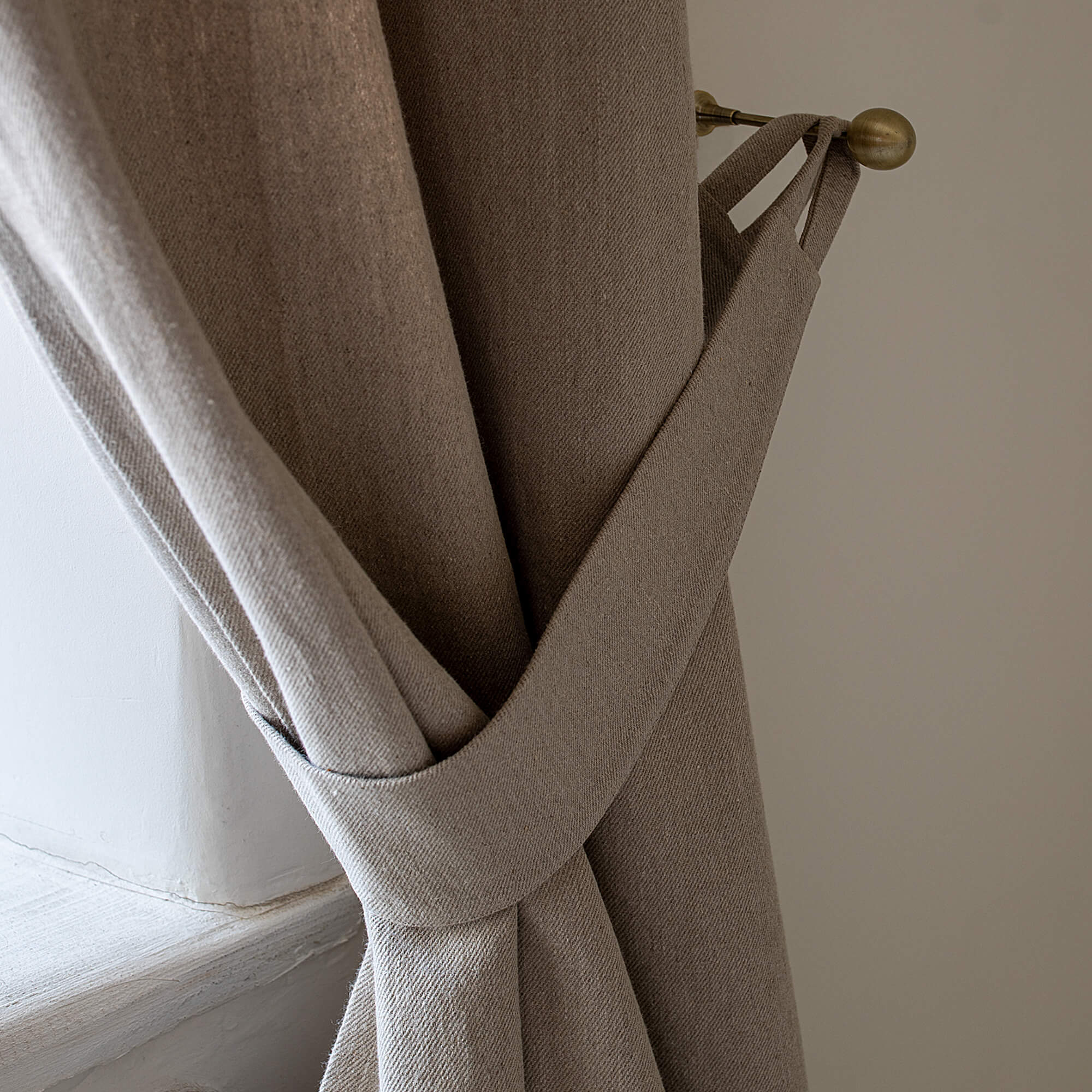 Our rustic heavy linen curtain tie-back is the perfect solution for keeping your curtains looking neat and stylish. Made from the highest-quality European linen, they offer durability and a luxurious feel.