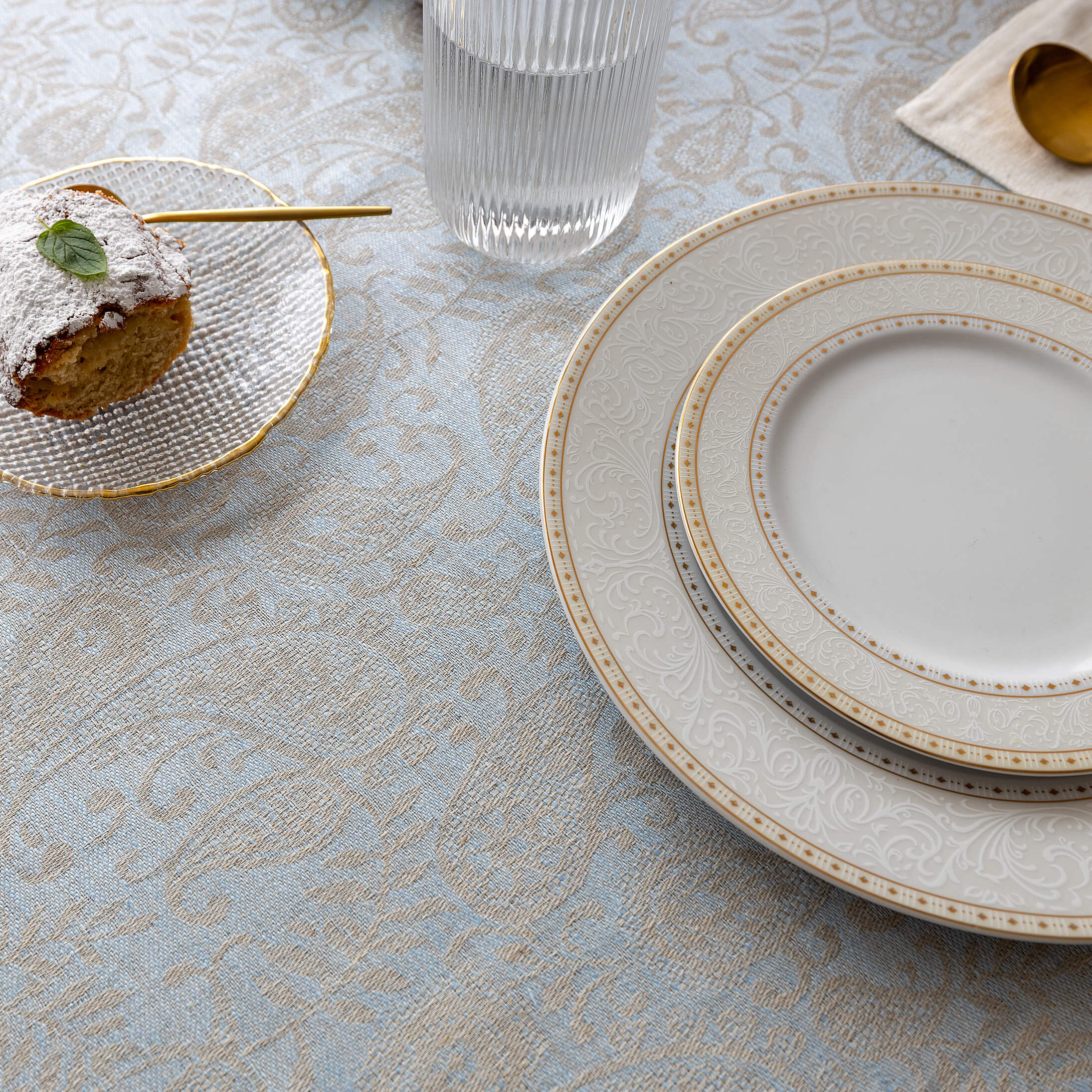 Close-up of the sky blue and beige paisley floral jacquard weave