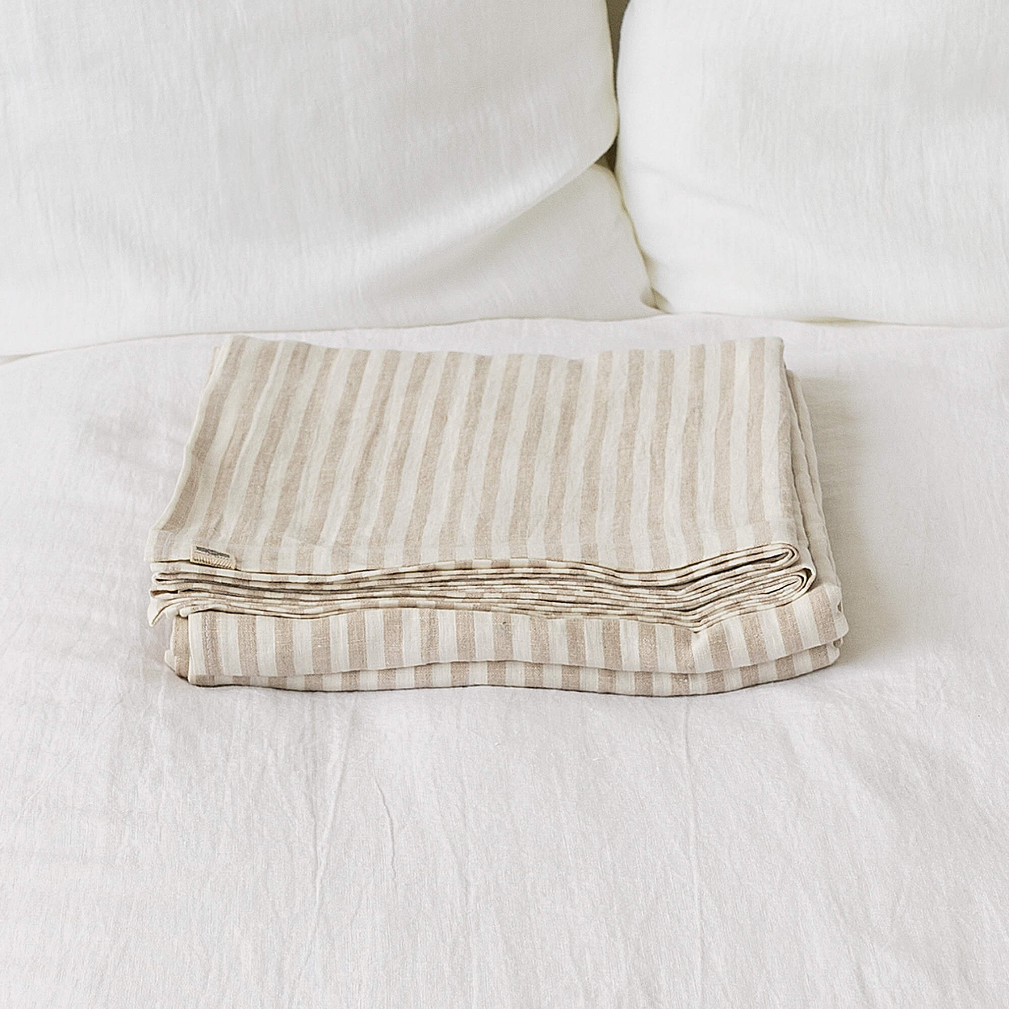 Linen flat sheet, elegantly striped in white and natural tones.
Crafted for the modern bedroom, these sheets offer unparalleled softness and breathability, ensuring a comfortable night's sleep year-round.