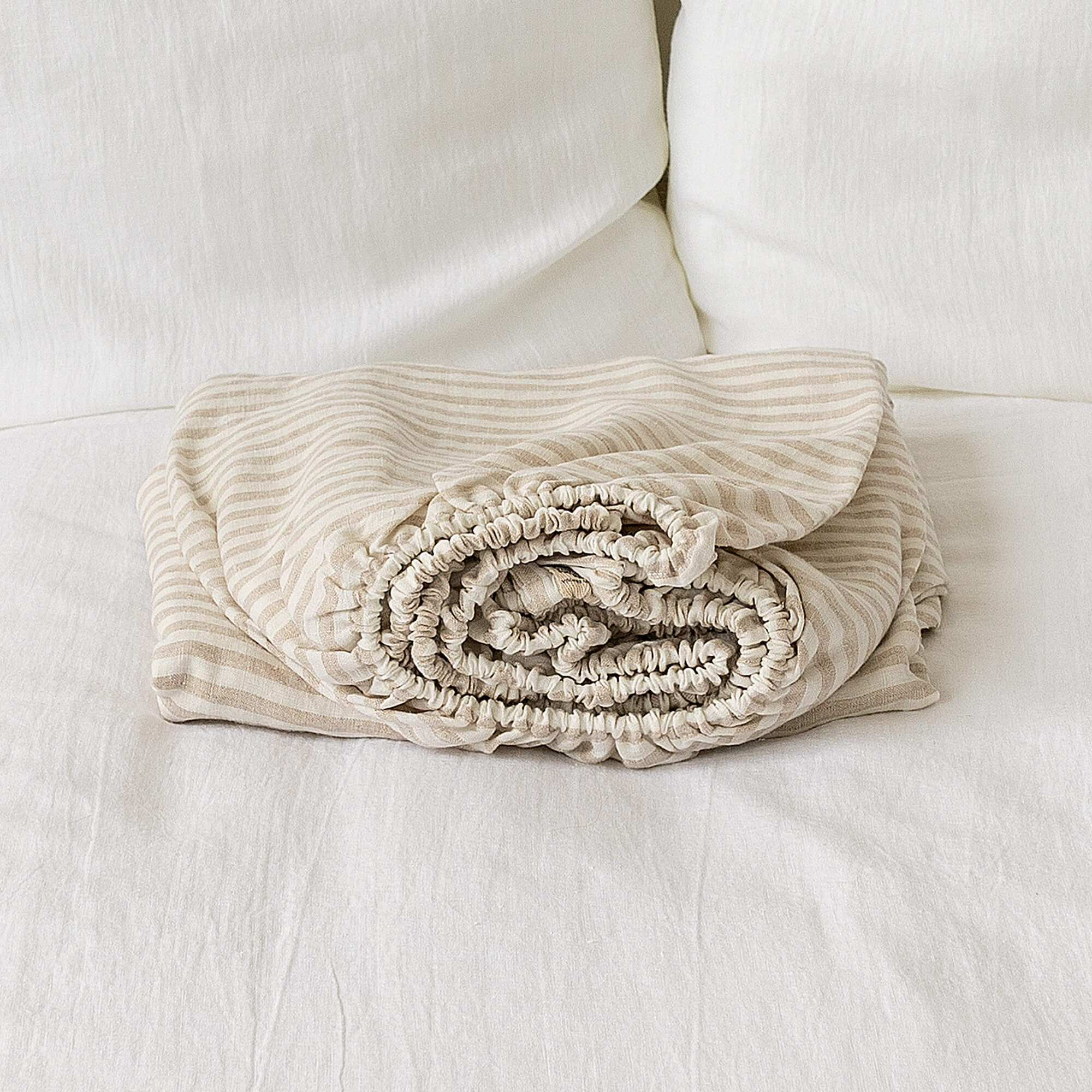 Delicately striped in a harmonious blend of white and natural hues.
Crafted with care, these sheets offer a gentle touch and unparalleled breathability, ensuring a restful night's sleep in every modern bedroom.
